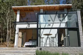 Beautiful glass house with a view and lush water - Image 2