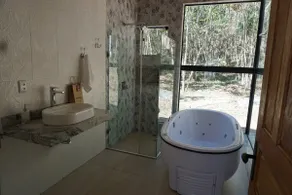 Beautiful glass house with a view and lush water - Image 3