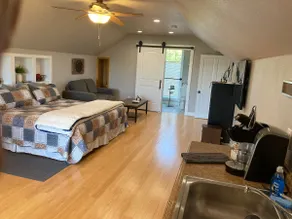 Farm Style Suite overlooking a hillside pasture. - Image 2