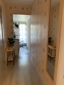 An apartment with a kitchenette. - Image 2
