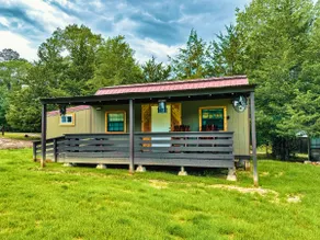 Riverfront house with a party barn & private boat ramp - Image 4