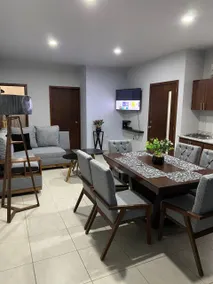 Luxurious Apartment #1 with a living room, dining room, and garage - Image 2