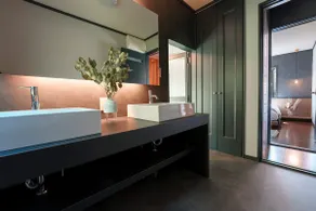 A stylish house with a view of the sea surrounded by blue skies and orange trees - Image 5