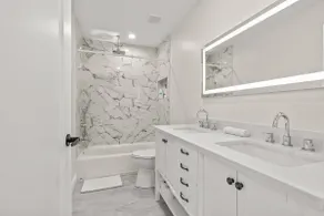 Modern 2BR with Private Rooftop and Skyline Views - Image 5