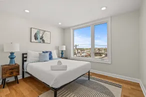 Modern 2BR with Private Rooftop and Skyline Views - Image 4