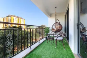 Elegant 2BR Central Haven w/ Pool, Gym & Rooftop - Image 2