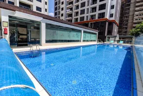 Elegant 2BR Central Haven w/ Pool, Gym & Rooftop - Image 4
