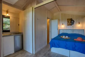 Wooden cabin on stilts at the campsite - Image 3