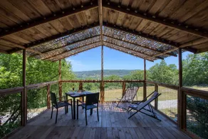 Wooden cabin on stilts at the campsite - Image 2