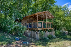 Wooden cabin on stilts at the campsite - Image 5