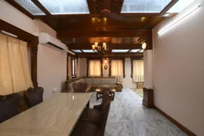 ”Saffron” Luxurious Teak Wood Themed Penthouse - Image 4