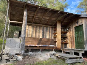 Intimate cabin with lean-to. - Image 2
