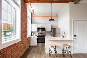 Jennifer's Historic Loft Glass Bedroom - Image 2