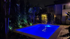 Leafy green guesthouse with pool - Image 2