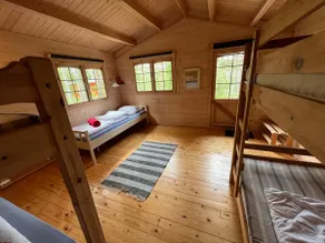 Nice cabin in the woods near water with canoe - Image 3