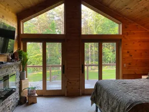 Beautiful log cabin in the trees. - Image 3