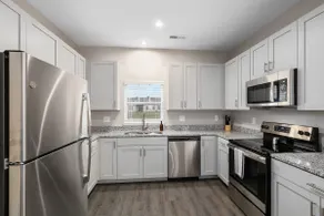Modern New Build 2BR + 2BA Condo w/ Garage + Patio - Image 4