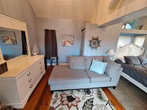 Ocean Cabin 23 is a cozy seaside bungalow with loft, limited ocean views, and private beach. - Image 3