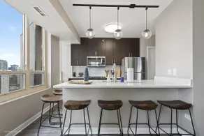 Elegant 2BR with Resort Amenities & City Views - Image 2