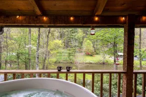 Log Cabin on the river w/Hot Tub and Fenced Dog Run - Image 4