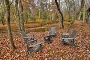 Indulge in "Just One More Night", a pet-friendly creekfront retreat boasting a spacious outdoor deck, hot tub, firepit, and WiFi - Image 4
