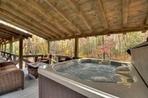 Indulge in "Just One More Night", a pet-friendly creekfront retreat boasting a spacious outdoor deck, hot tub, firepit, and WiFi - Image 3