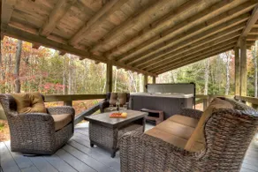 Indulge in "Just One More Night", a pet-friendly creekfront retreat boasting a spacious outdoor deck, hot tub, firepit, and WiFi - Image 2