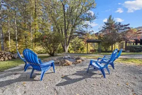 Bright 2BR Cabin with Sunroom Firepit Near Trails - Image 4