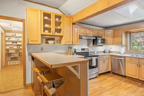 Bright 2BR Cabin with Sunroom Firepit Near Trails - Image 3