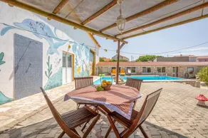 Eclectic oasis with poolside charm in Arranhó - Image 2