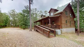 Acorn Acres is a true log cabin nestled in - Image 3