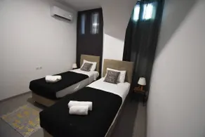 Two-Bedroom Apt Semi-Basement Aristotelian Suites - Image 3