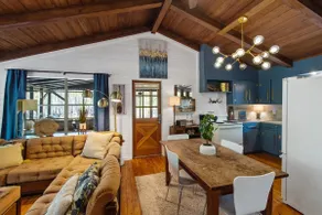 Emerald Cottage offers a laid-back stay surrounded by towering trees, with a spacious deck, kayaks and canoes to paddle through the cypress forest, and a firepit perfect for slow evenings outside. - Image 3