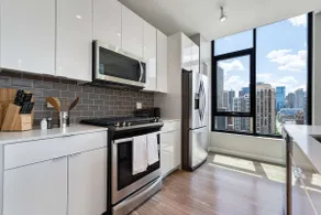 Downtown 2BR Oasis: Skyline Views + Prime Location - Image 2