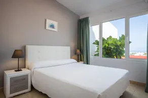 Sunny Haciendas IV · 2BR Apt with Sea View Balcony - Image 4