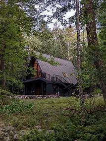 Cozy Vermont A-frame on a quiet private road, minutes from Stratton. Enjoy year-round adventure, then unwind in the hot tub under the stars. Spacious, stylish, and perfect for groups seeking both relaxation and outdoor fun. - Image 3