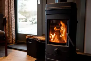 Scandinavian wooden cabin with wood-burning stove - Image 2