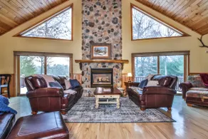 Large lakeside home with hot tub, gazebo, dock, firepit, and fenced in yard! - Image 2