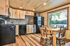 Remodeled lakeside resort cabin with fireplace, sandy beach, dock, firepit! - Image 4
