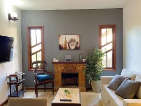 House with a fireplace in nature - Image 3