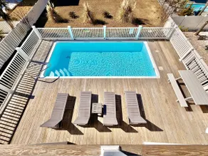 Sally's Sandcastle in Oak Island boasts 7 bedrooms, ocean views, and a private pool. - Image 3