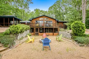 Lakefront Log Cabin with Sunset Views and Dock - Image 4