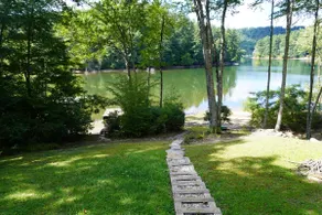 Lake front with private dock, fire pit, hammock, pool table & gorgeous views! Fishing poles, paddle boards & canoe provided. - Image 5