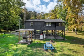Riverfront Cabin wFirepit Pool Table Porch WiFi - Image 2