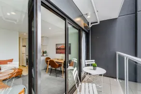 Stylish Modern Unit w Balcony and Pool Zodiak Stays - Image 3