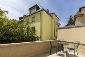 Elegant 1BR Retreat with Patio Near Kirchberg - Image 5