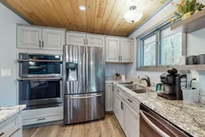 Cozy Wooded Home: 2 Kitchens near Lakes & Trails - Image 5