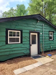 Green Cabin in the Woods - Image 2