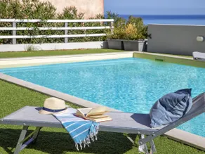 The terrace overlooking the pool by Interhome - Image 2