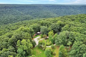 Cliffside Cabin Escape in the Woods - Image 4